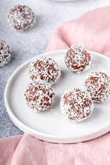 Cacao Date Energy Bites on a white blue background