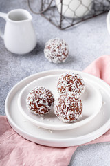 Cacao Date Energy Bites on a white blue background