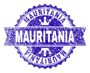 MAURITANIA rosette stamp seal imprint with distress texture. Designed with round rosette, ribbon and small crowns. Blue vector rubber watermark of MAURITANIA caption with scratched texture.