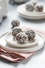 Cacao Date Energy Bites on a white blue background