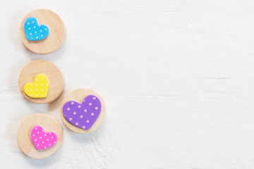 Valentine, love and wedding background concept. Colorful heart on white wood table. Picture for add text message. Backdrop for design art work. Sweet and pastel color tone.