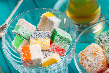 various pieces of turkish delight lokum and black tea