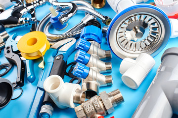 plumbing tools and equipment on blue background.