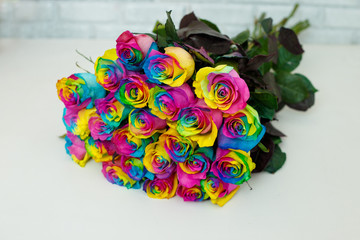 Fototapeta na wymiar a bouquet of rainbow colored roses