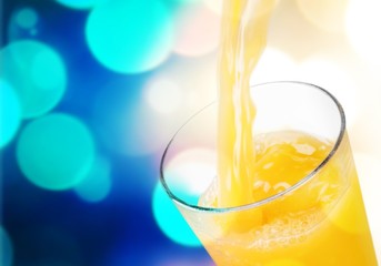 Orange juice glass on background