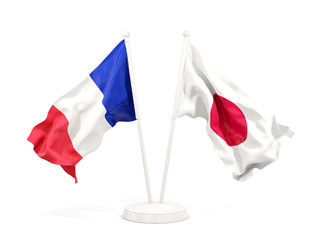 Two waving flags of France and japan