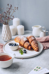 Croissants with berries on a white background