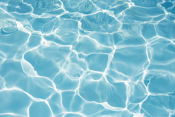 Texture of water in swimming pool for background