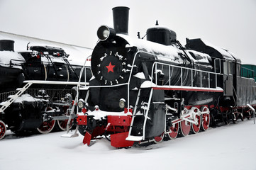 The Museum of history and technology, Kharkov, Ukraine - January 2016. Old black steam locomotive in the Museum. The locomotive installed as a monument.