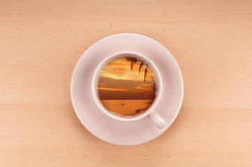 tropical sunset in a cup of coffee wanderlust concept