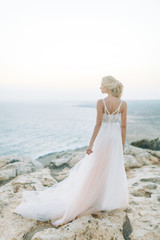 Wedding in the mountains at sunset on the beach of Cyprus. The happy couple and a beautiful view.