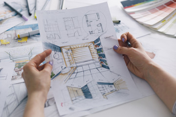Interior designer working on color hand drawings of bathroom interior at work place. Photo of...