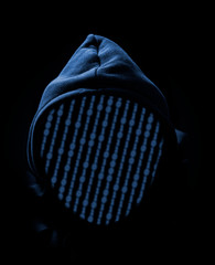 Faceless hooded anonymous computer hacker