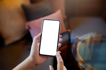 hands of woman holding empty white mobile smart phone