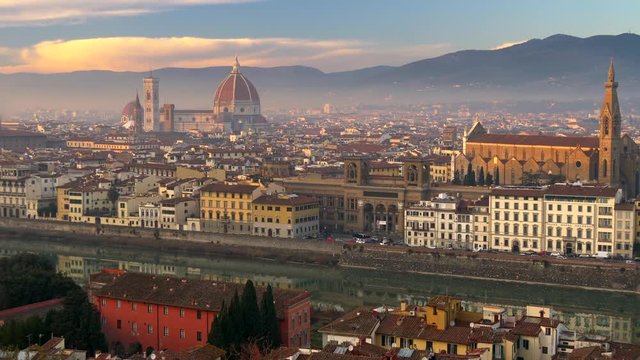Beautifull Florence, Italy. Panning shot of foggy Florence old city center at sunset lights. Shot from Michelangelo square. UHD, 4K
