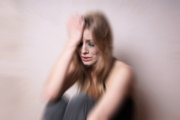 Fototapeta premium sad young woman with tear-stained face crying. depression concept. with zoom effect.