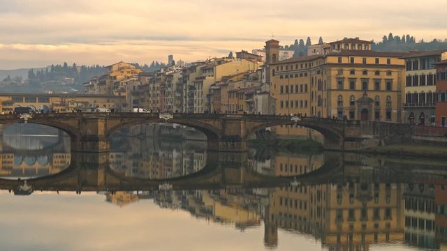 Panning shot of Florence (Firenze) bridges and old houses, Italy
