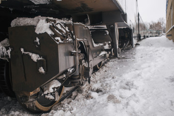 Train Car Undercarriage. Close-ups Steel diesel railcar train bogie wheels on the tracks winter
