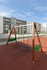 New playground on yard near the modern house