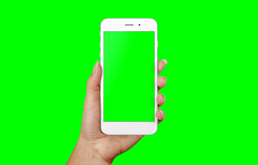 Modern white smart phone in woman hand. Isolated screen and background in green, chroma key.