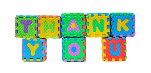 THANK YOU shaped by alphabet jigsaw puzzle on white