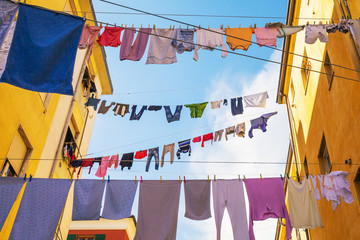 Drying of clothes in in italian city. - Powered by Adobe