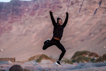Black guy jumping and screaming