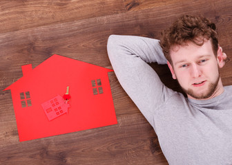 Man lying with house symbols.