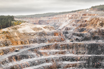 View from above on opencast mining quarry for the extraction of ironstone magnetite ores with the...