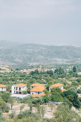 Fototapeta na wymiar Beautiful Cypriot landscapes in summer. City streets and mountains in nature.