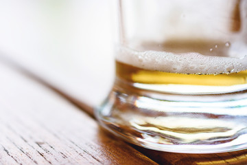 Empty Glass Of Cold Beer With Foam On Wooden Table