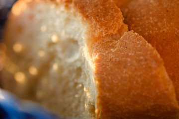 Tasty Loaves Of Traditional Homemade Bread In Blue Wooden Basket Close-Up