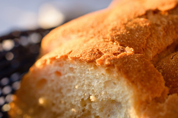 Delicious Traditional Homemade Bread In Blue Wooden Basket At Sunset