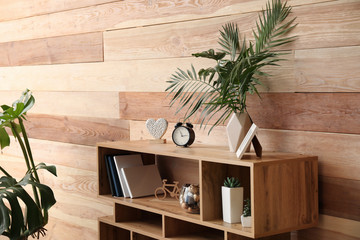 Green tropical leaves in interior of room