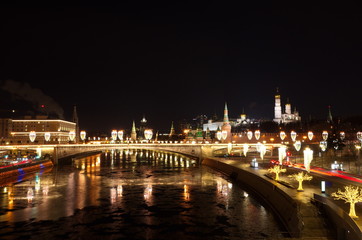 Fototapeta na wymiar Evening view of the Moscow Kremlin and Big Moskvoretsky bridge with Christmas illumination, Moscow, Russia