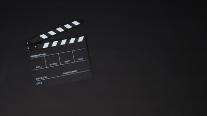 Clapperboard or clap board or movie slate use in video production ,film, cinema industry on black...