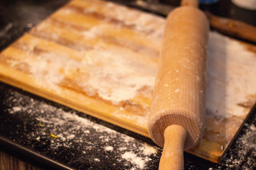Cooking food. Flour on the board.