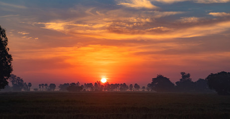 Beautiful orange sunrise at the horizon. Srisaket. Thailand