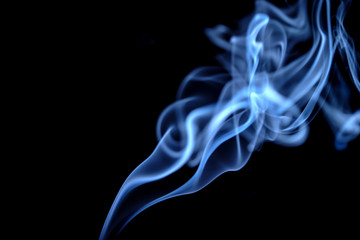 Obraz premium Blue Smoke on Black Background
