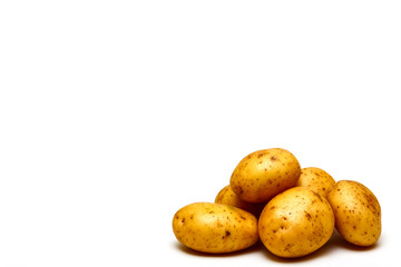 Raw potatoes isolated on a white background with copy space