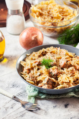 Creamy farfalle pasta with salmon, parmesan cheese and dill