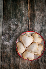 Homemade heart shape cookies with vanilla custard cream