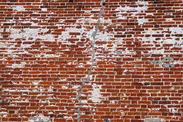 repaired crack in red brick wall