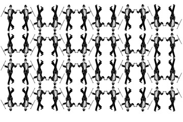 male magician in a tuxedo wearing a bowler hat dancing