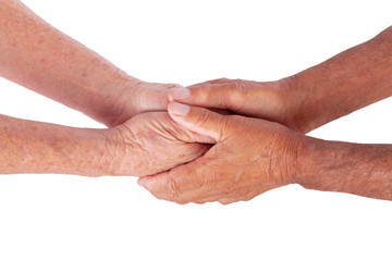 Fototapeta premium Closeup of mature caucasian man and woman holding hands isolated on white background. Metaphor for new or old love, friendship and acceptance. Inspiration for Valentine's Day poster and meme.