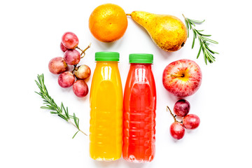 bottles of smoothie with fruits on white table top view mock up