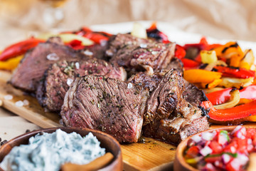 meat meal served on the wooden plate
