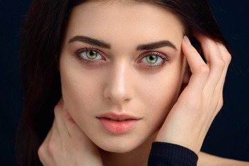 Beauty portrait of a young woman in the studio