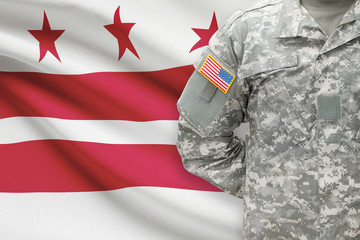 American soldier with US state flag on background - Washington, D.C. - District of Columbia
