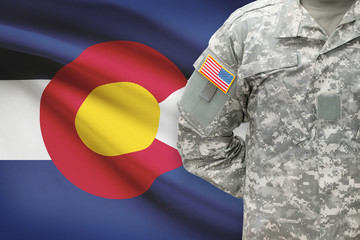 American soldier with US state flag on background - Colorado